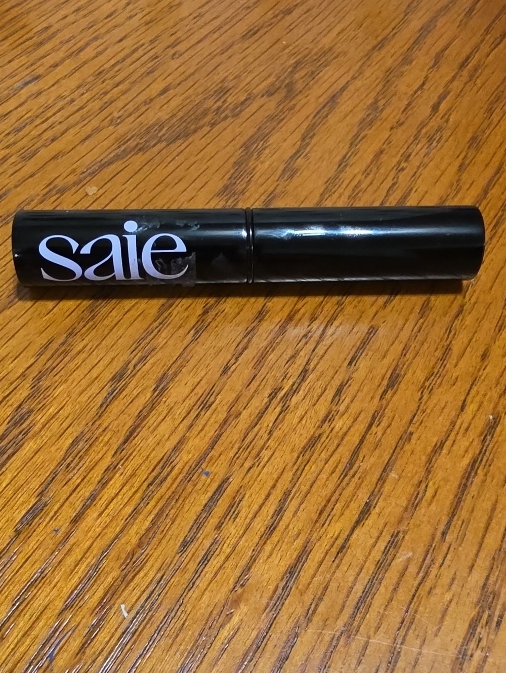 Saie Lip Gloss Balm in Black Packaging